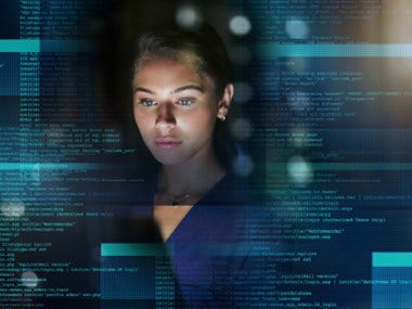 A lady watching data on big screen