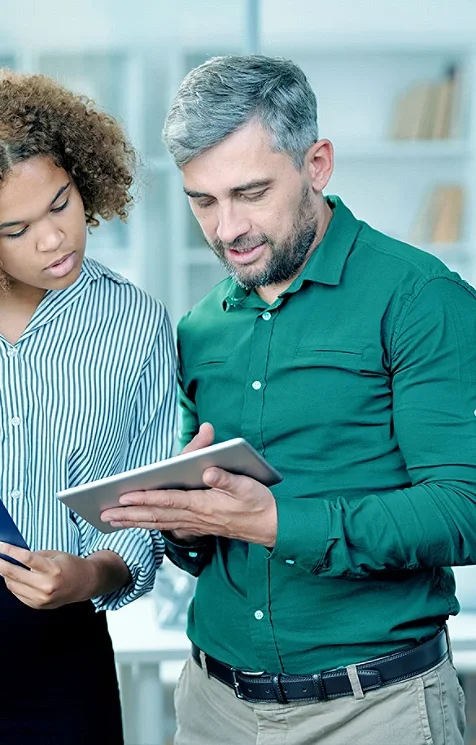 Man and woman looking at a tablet