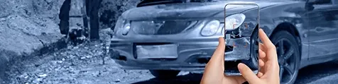 Someone taking photo of car with mobile phone