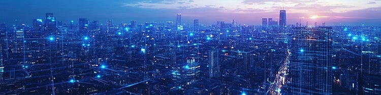 A cityscape illuminated by blue lights and tangled wires, creating a vibrant and electric nighttime atmosphere.