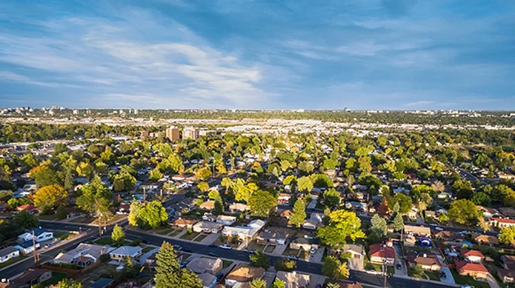 Aerial view of a suburban neighborhood with houses and trees