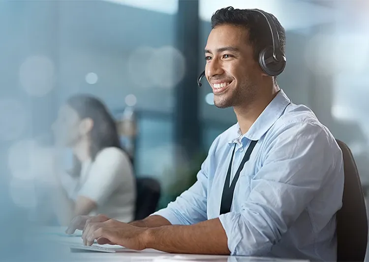 A smiling customer care rep at work
