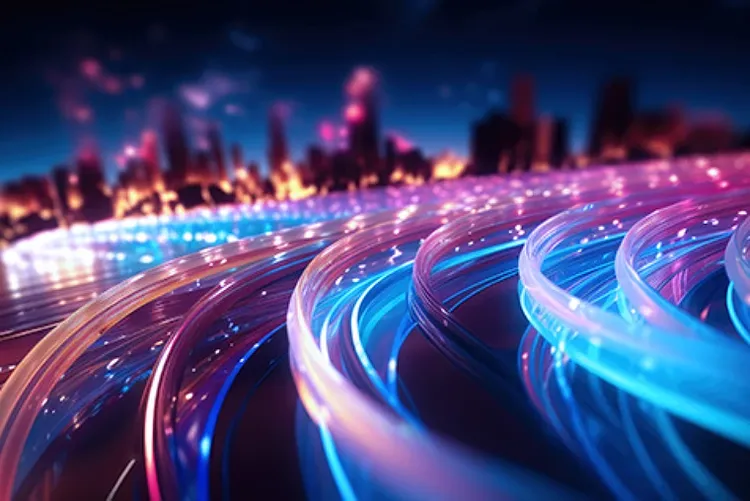 Streaks of light depicting fast-moving trafic against a blurred out cityscape