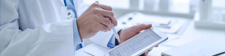 A doctor ineractive with a tablet