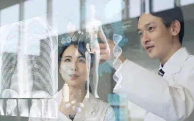 Healthcare professionals interacting with a glass screen