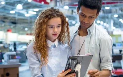 Two people watching Ipad