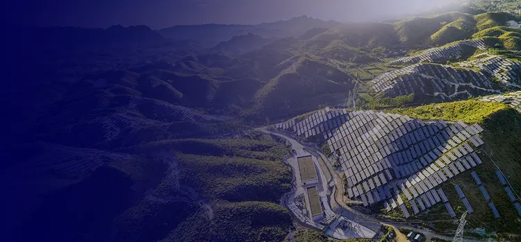 A picture of hills covered with solar panels