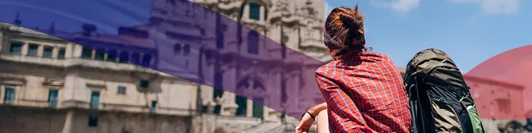 A traveller sitting and watching building