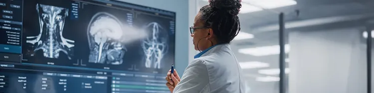 A lady doctor observing x-rays