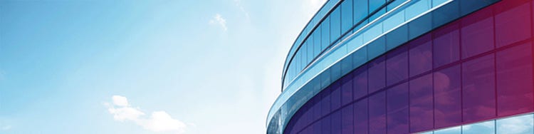 A modern building with curved glass architecture