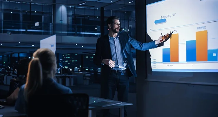 A man presenting a report to colleagues