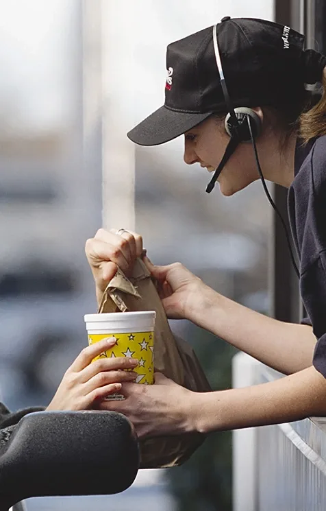 A woman provides food to a traveler