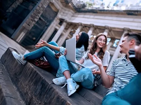 Two girls and a boy having a discussion