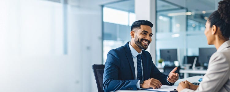 Bank teller talking to the customer with a smile