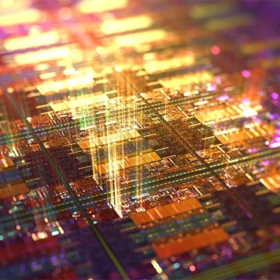 A vibrant computer chip featuring a variety of colors and intricate circuitry patterns.