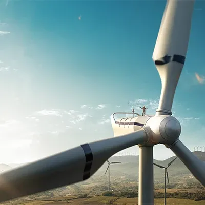 Closeup view of a wind turbine in a wind energy harvesting farm