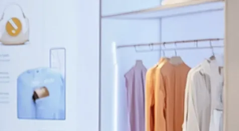 View of shirts hanging in a closet.