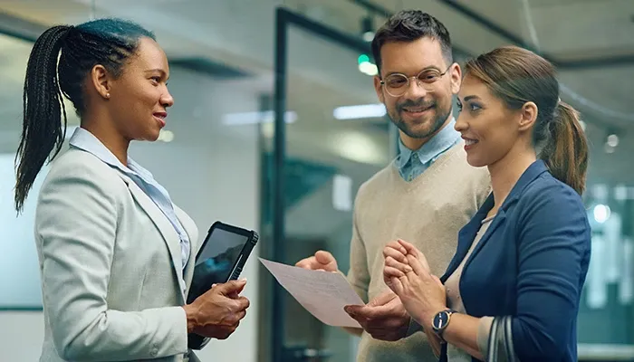 Team discussing about insurance in office