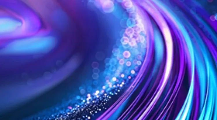 Neon pink, purple and blue light trails flowing across a dark background.